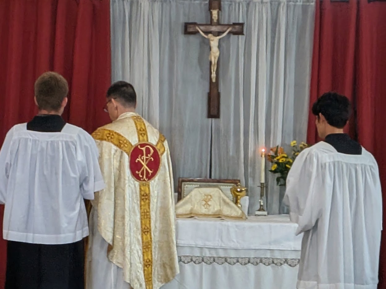 Priest and altar servers during the festival Mass
