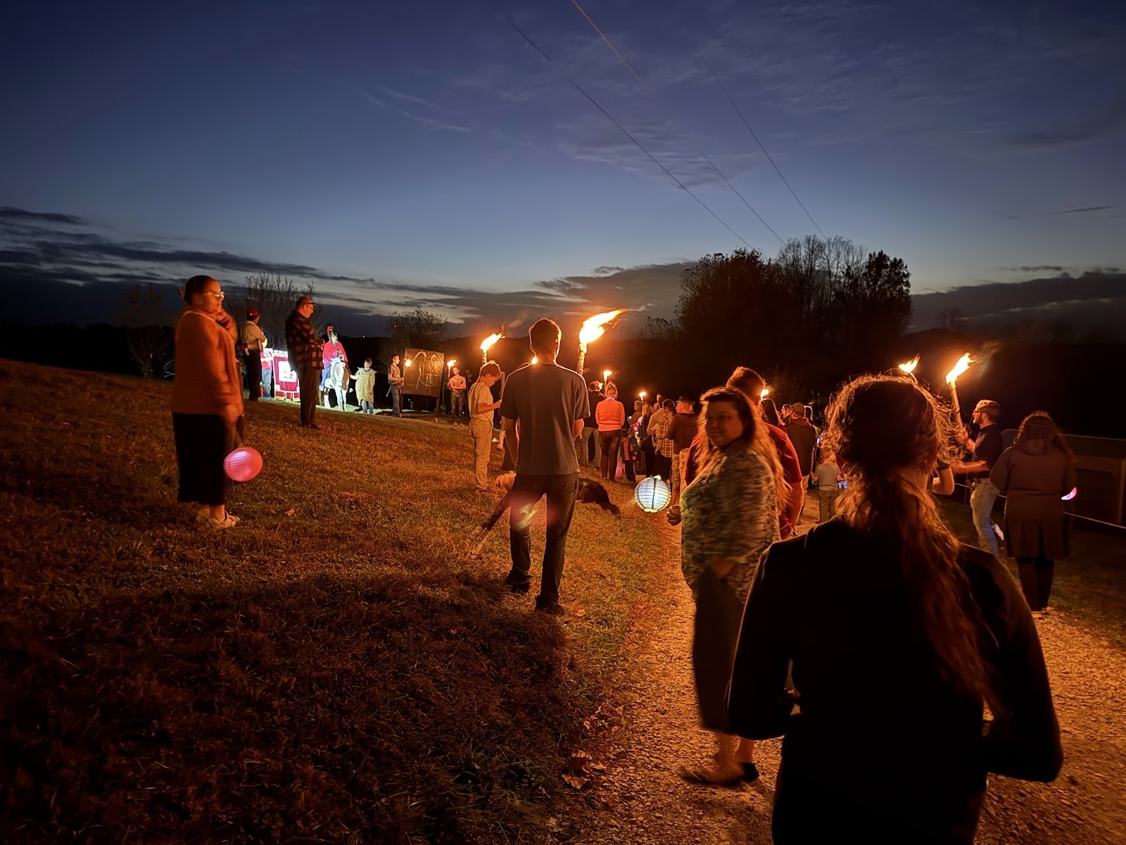 Lantern and torch parade at dusk